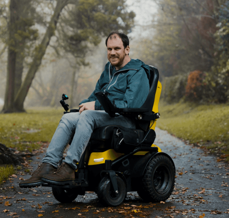 Freedom One Life founder Alex in a powerchair