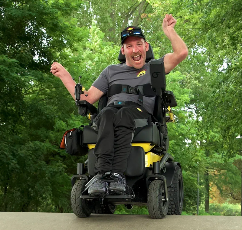 A man using a powerchair outdoors